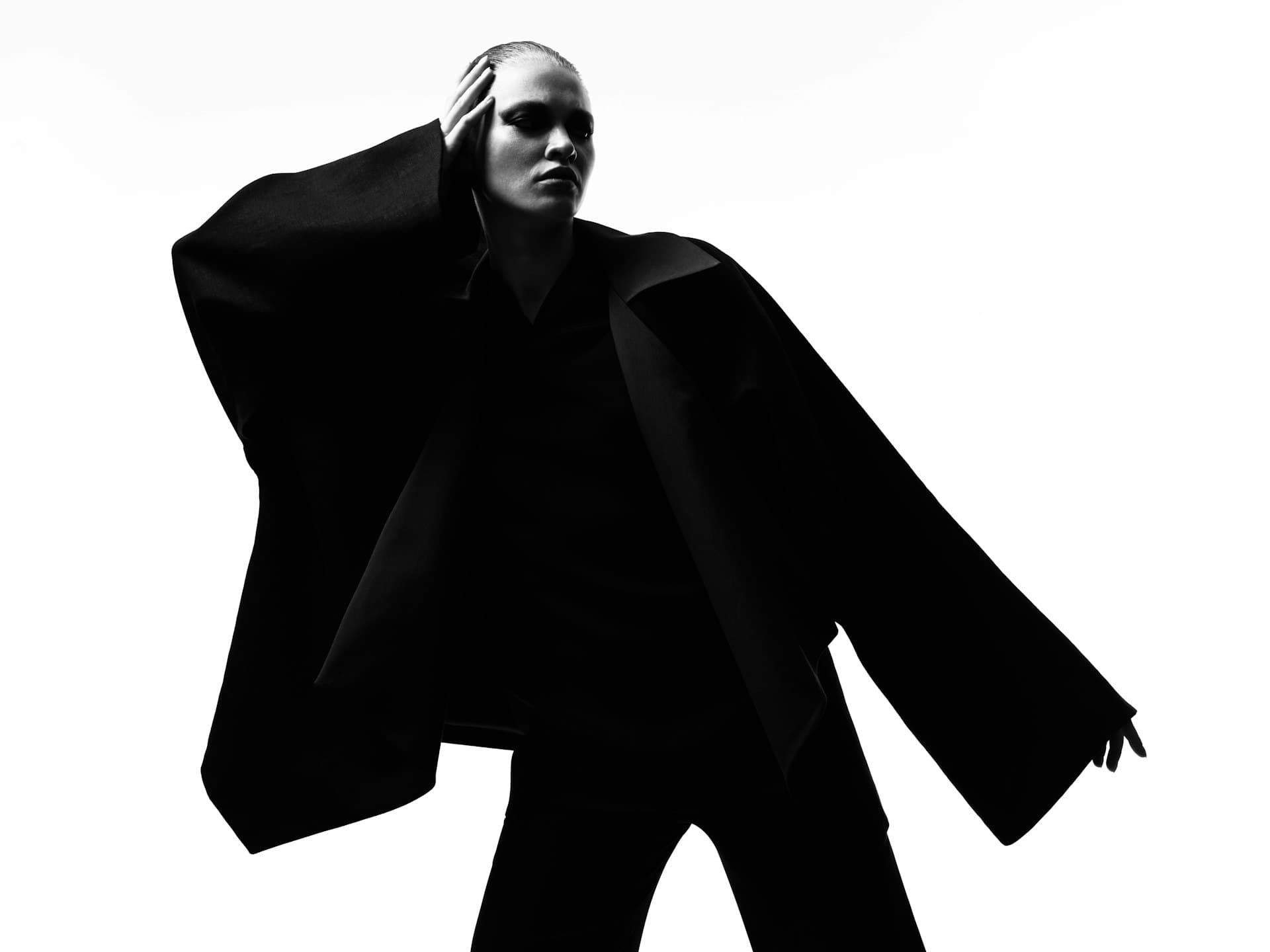 Fashion photography in the studio, fashion photoshoot with a black silhouette