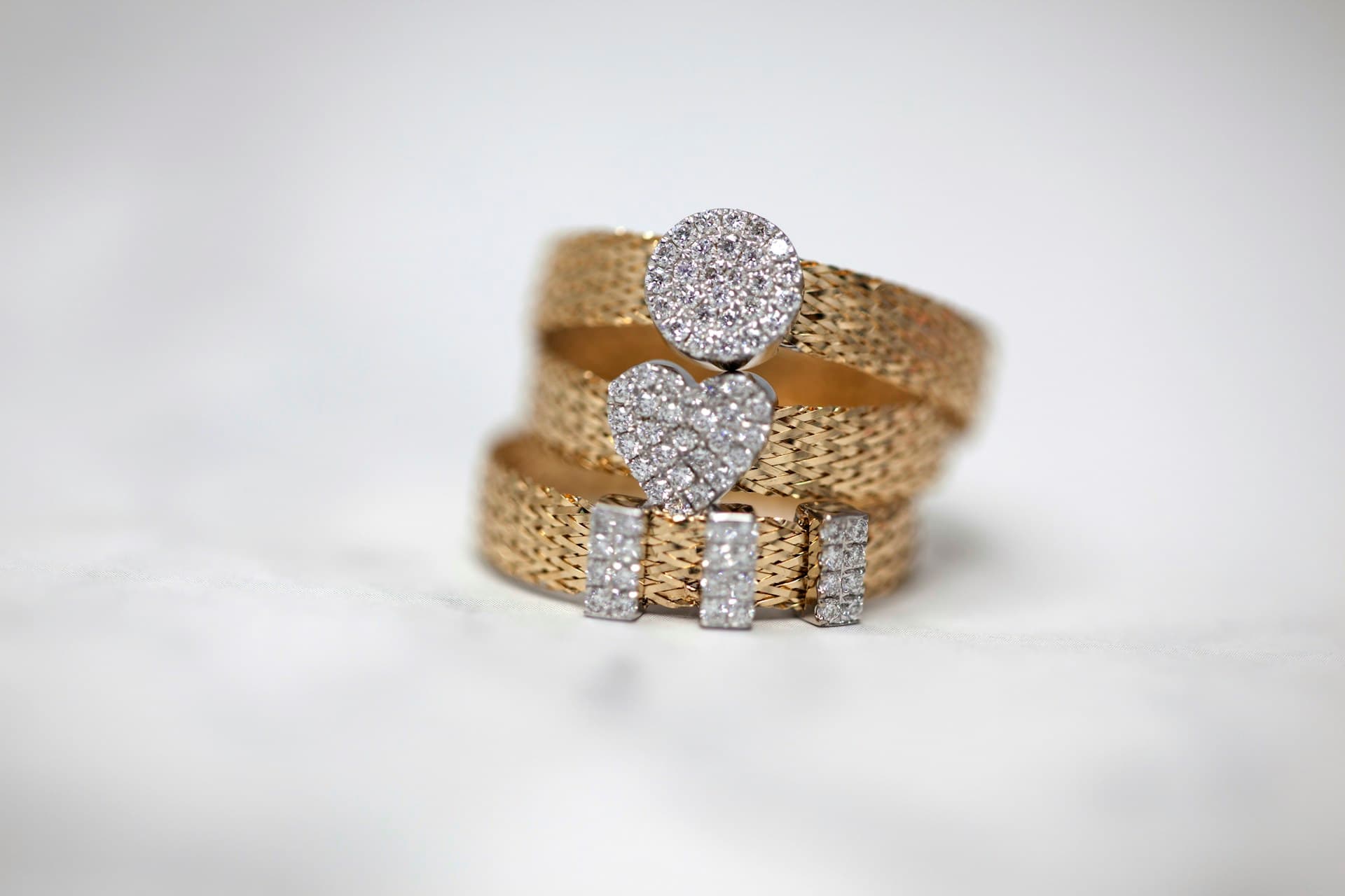 Gold rings on a light background, e-commerce shot - ring photography