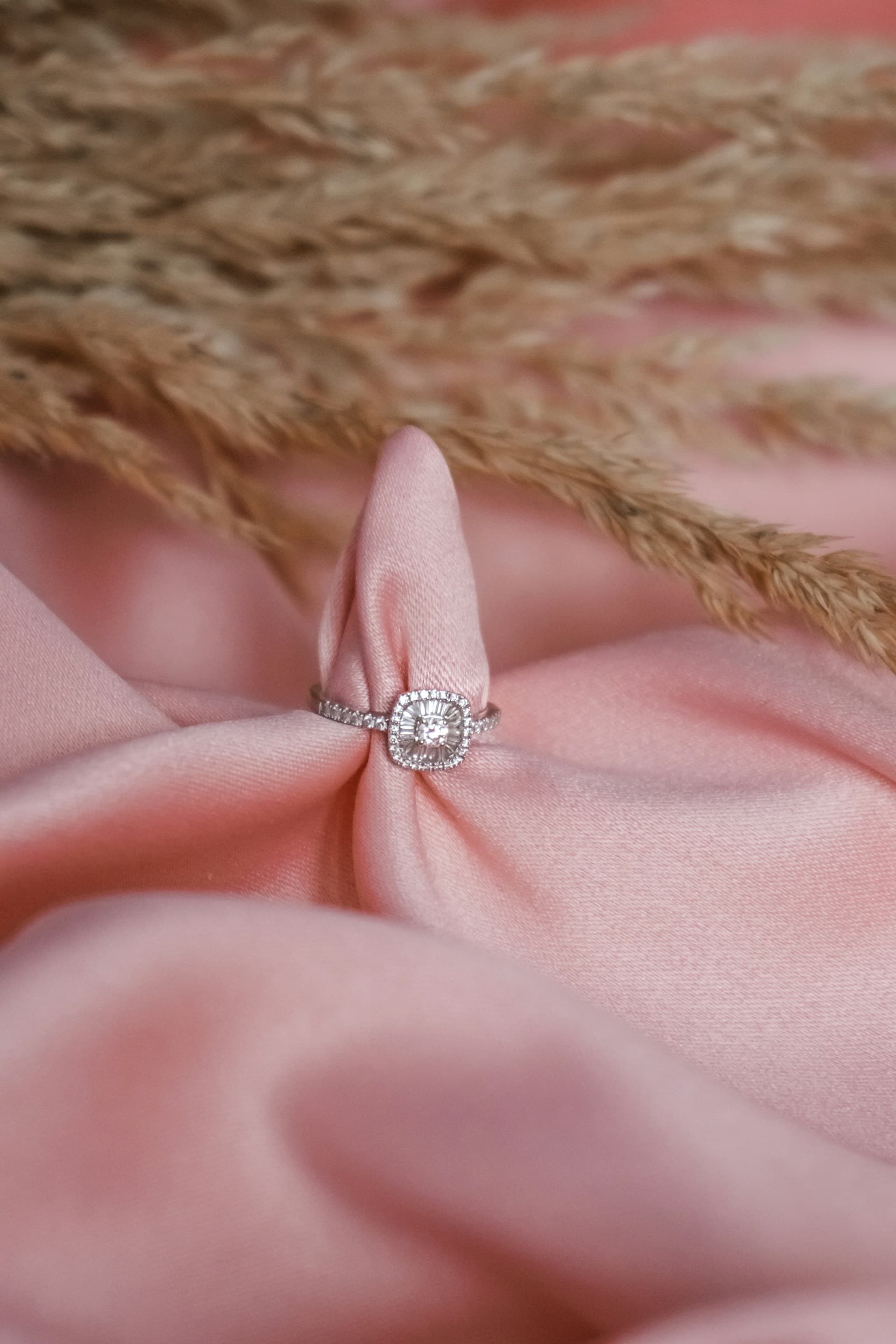 Ring on fabric texture, lifestyle shot - jewelry product photography