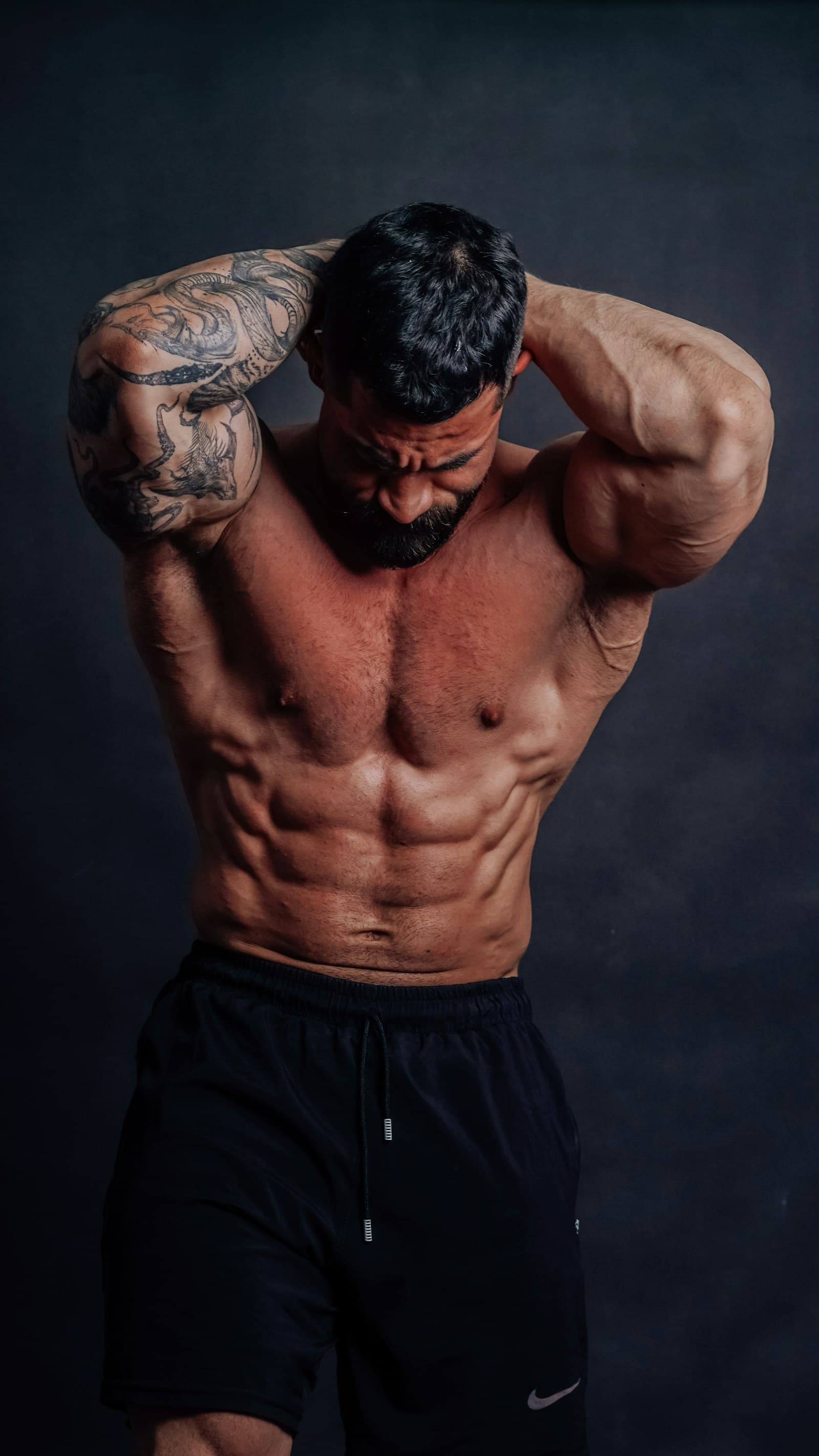 Athletic studio portrait on a dark background - fitness photography, Emma Studio Tbilisi