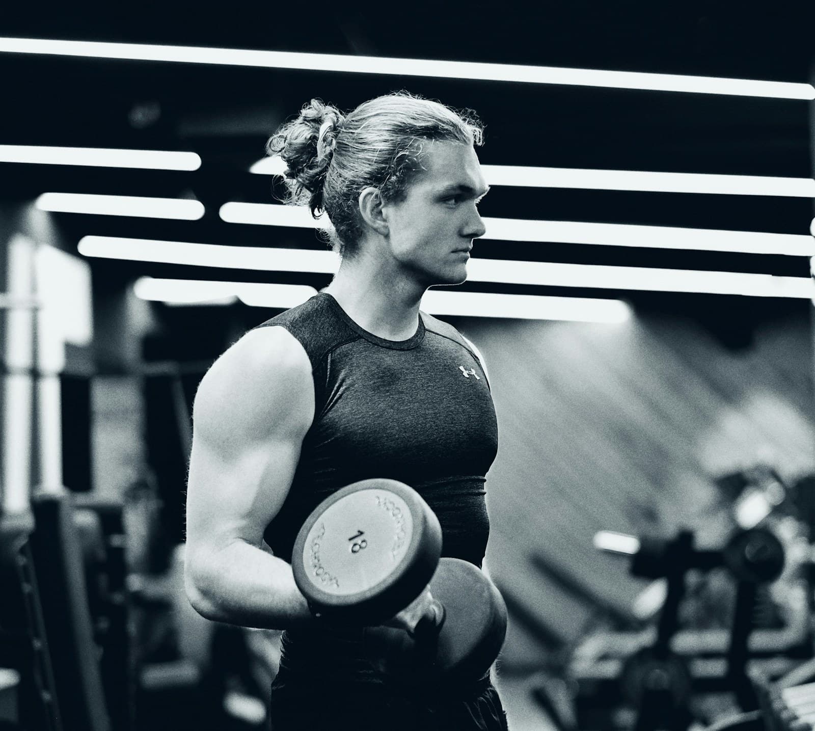 Woman training with weights - fitness photo session at the gym